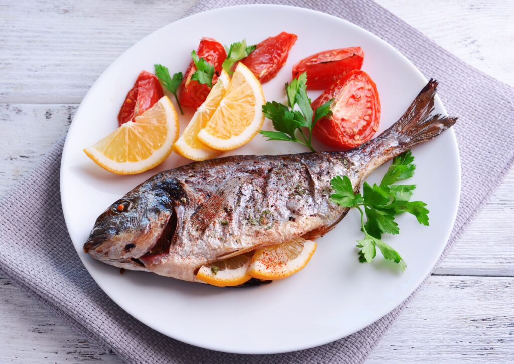 whole baked fish on plate