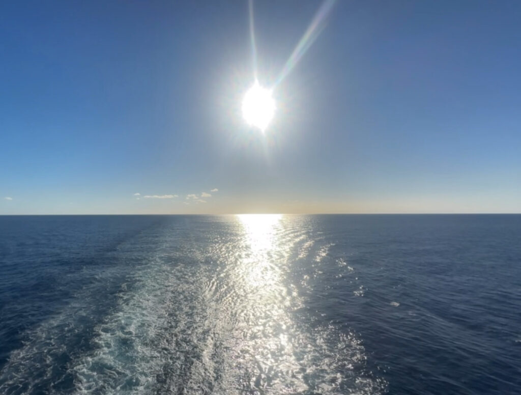 view from ferry sun on water